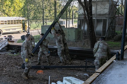 U.S. Soldiers and Airmen with the District of Columbia National Guard clean up building 12 at the Youth ChalleNGe Academy to help the facility expand and reach more youth in Laurel, Md., Oct. 1, 2025.  About 2,300 National Guard members are supporting the D.C. Safe and Beautiful mission providing critical support to the D.C. Metropolitan Police Department in ensuring the safety of all who live, work and visit the District.