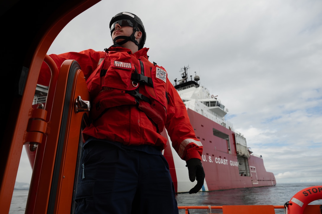Petty Officer 2nd Class Tyler Odette stands lookout on the back deck of the U.S. Coast Guard Cutter Storis’ daughter craft in Sitka, Alaska on Aug. 3, 2025. The small boat can carry up to 15 people and can support a variety of Coast Guard missions. (U.S. Coast Guard photo by Petty Officer 3rd Class Ashly Murphy)