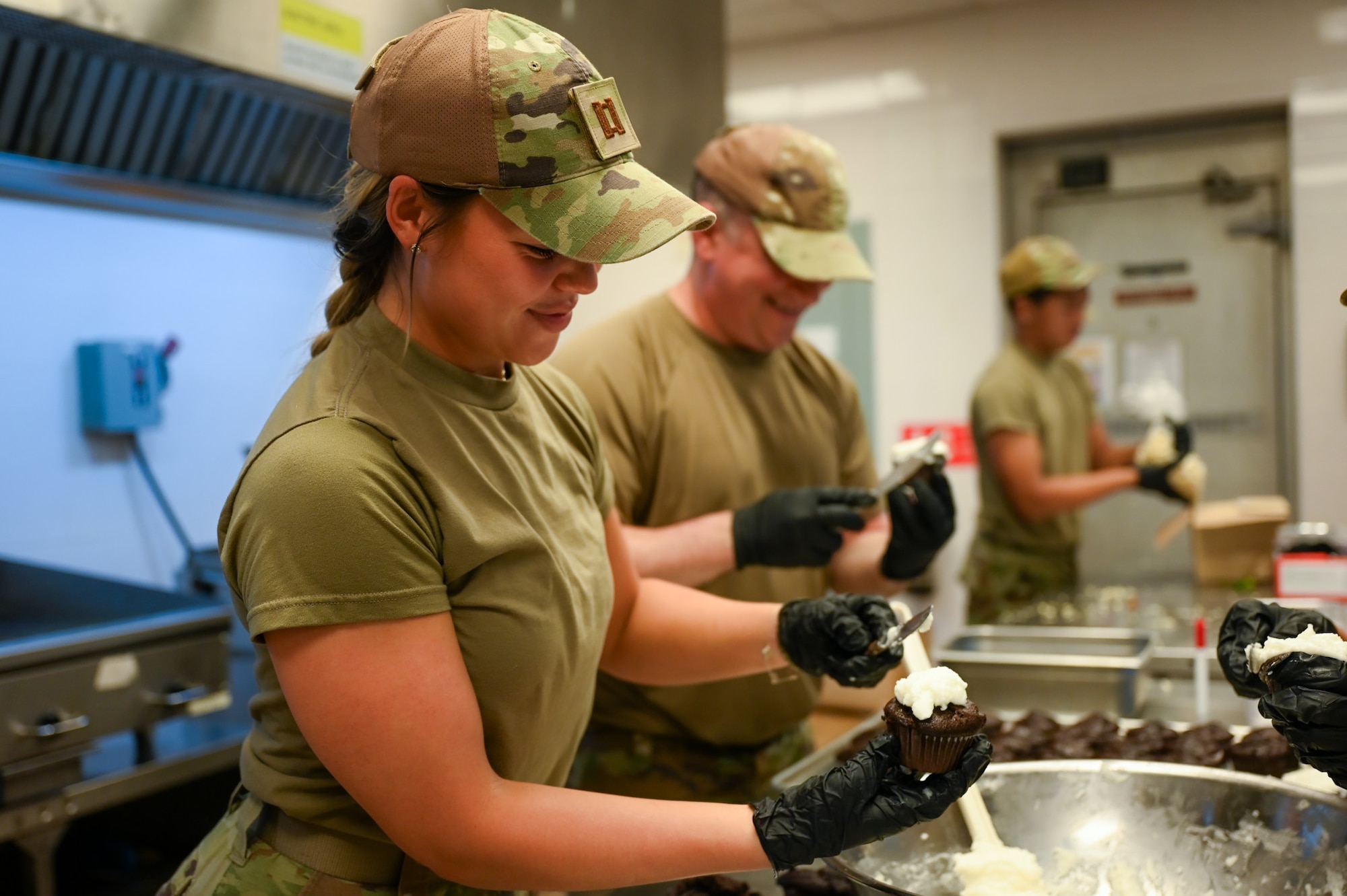 A U.S. Air Force Airman with the 11th Combat Air Base Squadron prepares a cupcake ahead of an Air Force birthday celebration at the dining facility at Daegu Air Base, Republic of Korea, Sept. 5, 2025. The cupcakes were given to every member of the 11th Air Task Force and 11 CABS who had or will have birthdays while deployed. (U.S. Air Force photo by Senior Airman Andrew Garavito)
