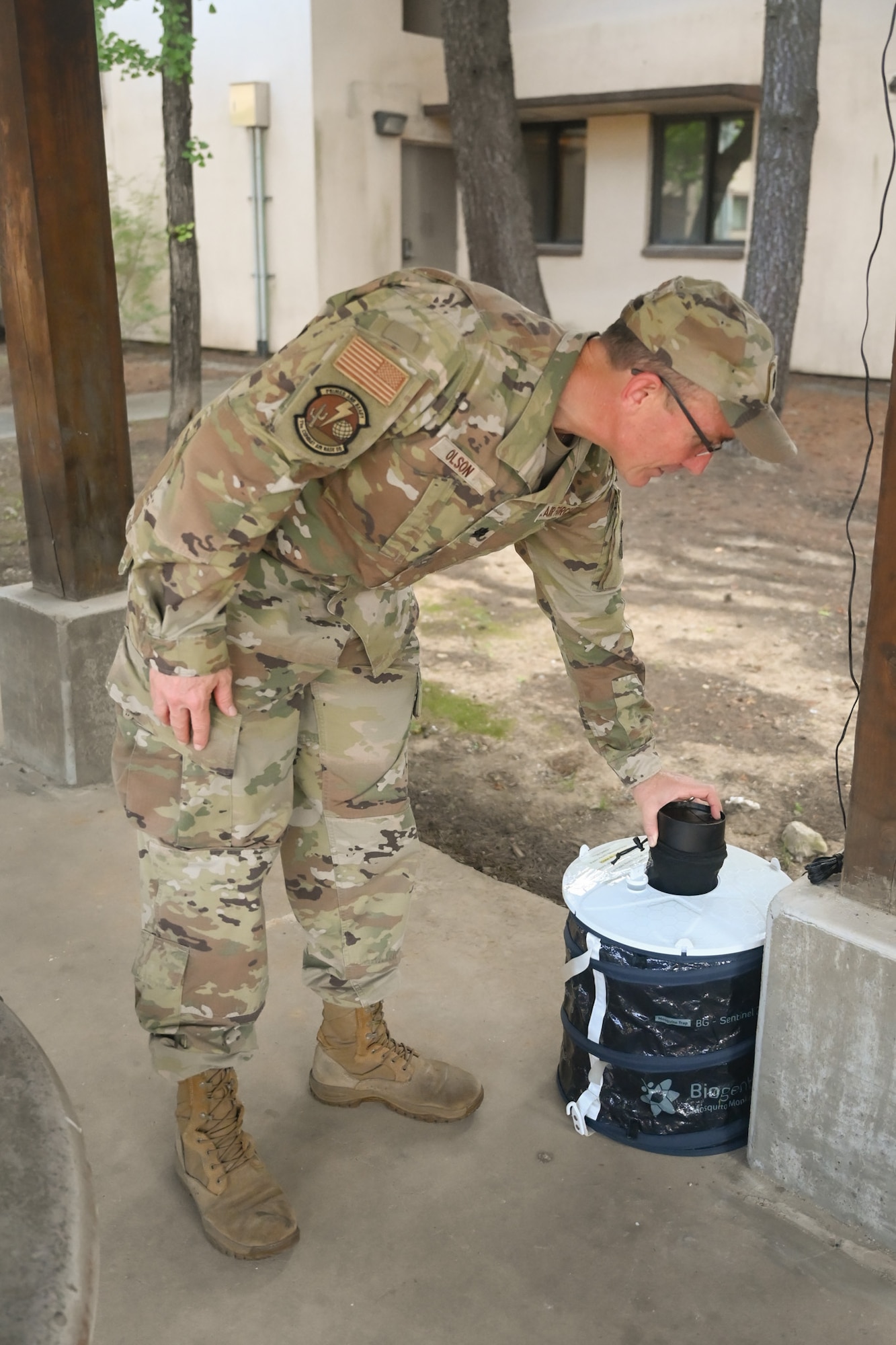 U.S. Air Force Lt. Col. Mark Olson, 11th Combat Air Base Squadron, checks one of his mosquito traps while conducting preventive medicine during exercise Ulchi Freedom Shield 25 at Daegu Air Base, Republic of Korea, Aug. 18, 2025. UFS 25 is a combined, joint, all-domain military training exercise that integrates ground, air, naval, space and cyber and information elements, enhancing readiness through realistic combat simulations. (U.S. Air Force photo by 2nd Lt. Grace Brandt)