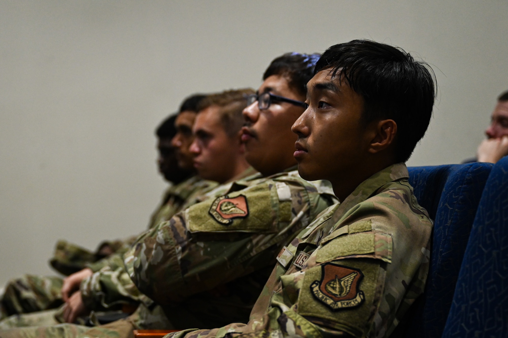 A U.S. Air Force Airman from the 51st Fighter Wing listens to an in-processing brief given by the 11th Combat Air Base Squadron while participating in exercise Ulchi Freedom Shield 25 at Daegu Air Base, Republic of Korea, Aug. 19, 2025. UFS 25 serves as a regular exercise between the ROK and the U.S., ensuring constant preparedness for military forces. (U.S. Air Force photo by Senior Airman Andrew Garavito)