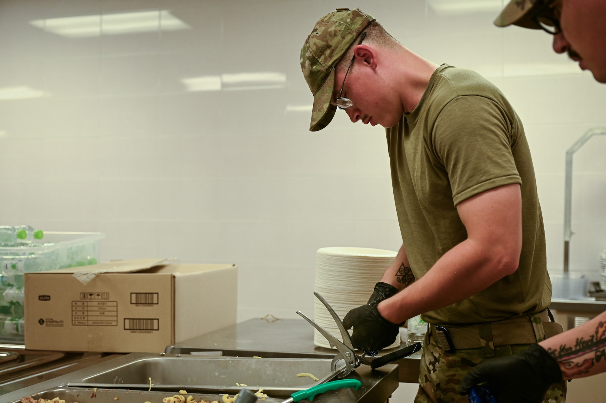 A U.S. Air Force Airman from the 11th Combat Air Base Squadron uses pliers to remove a metal container during exercise Ulchi Freedom Shield 25 at Daegu Air Base, Republic of Korea, Aug. 21, 2025. UFS 25 provides a rigorous training environment to enhance combat readiness and response capabilities. (U.S. Air Force photo by Senior Airman Andrew Garavito)