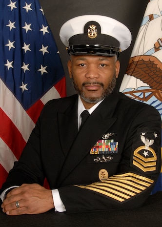 A command Master chief poses for an official photo.