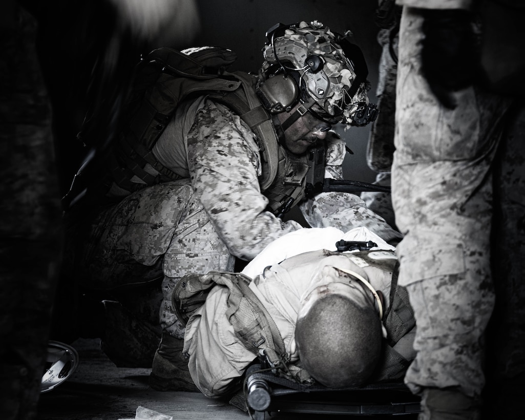 A U.S. Marine with India Company, Battalion Landing Team 3/5, 11th Marine Expeditionary Unit, provides medical aid to a simulated casualty during Vertical Assault Raid Course on Marine Corps Base Camp Pendleton, California, Sept. 24, 2025.