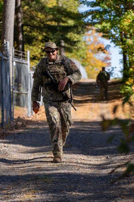 Chief Master Sgt. Michael Guthrie, with the 101st Air Refueling Wing Security Forces Squadron, begins the final stretch of the 12-mile march while participating in the Mogadishu Mile, Oct. 2, 2025, at Bangor Air National Guard Base, Maine.