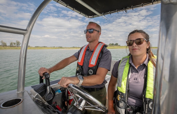 A photo of natural resources specialists searching for piping plover.