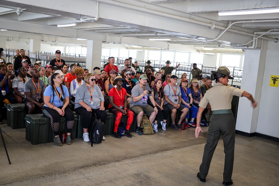 Educators and influencers participating in Marine Corps Recruit Depot (MCRD) San Diego's Educators Workshop receive the Drill Instructor speech onJune 24, 2024