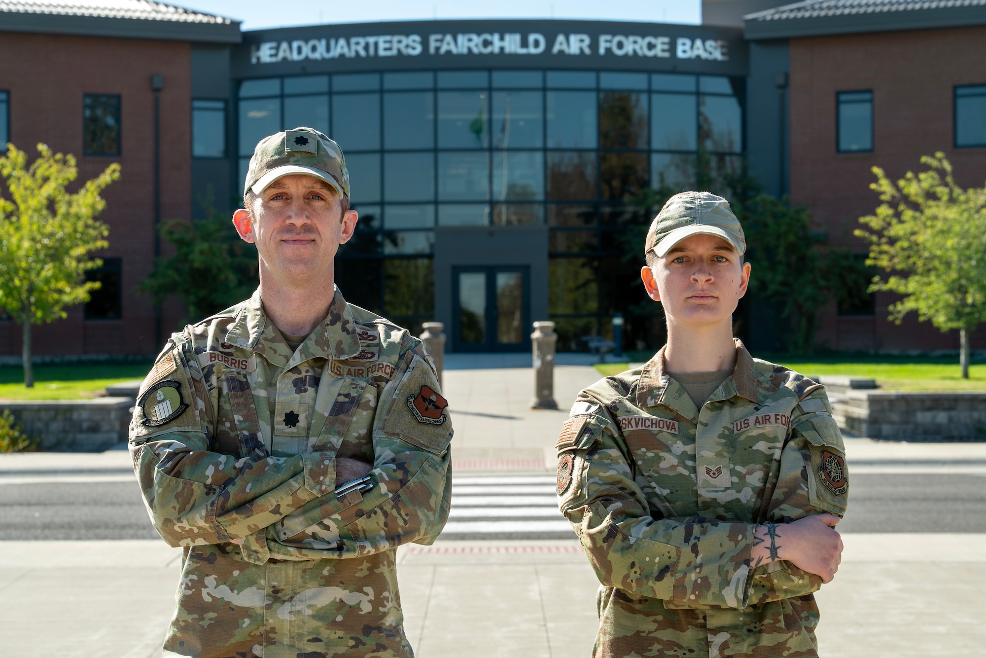 From left, U.S. Air Force Lt. Col. Andrew Burris, 336th Training Support Squadron commander, and Staff Sgt. Maria Moskvichova, 92nd Civil Engineer Squadron operations manager, stand in front of the Headquarters building at Fairchild Air Force Base, Washington, Sept. 26, 2025. Burris and Moskvichova were named the 2024 Air Force Language Capable Airmen of the Year in the officer and enlisted categories. (U.S. Air Force photo by Tech. Sgt. Heather Ley)