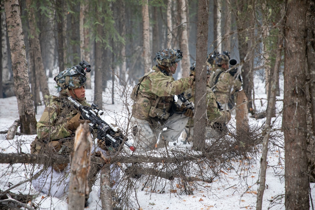 U.S. Army soldiers assigned to 3rd Battalion, 509th Parachute Infantry Regiment, 2nd Infantry Brigade Combat Team (Airborne), 11th Airborne Division, position themselves, ready to engage and destroy enemy ground forces during Joint Pacific Multinational Readiness Center 25-02, near Fort Greely, Alaska, Jan. 24, 2025.