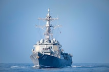 The Arleigh Burke-class guided-missile destroyer USS Roosevelt (DDG 80) as seen from the Ticonderoga-class guided missile cruiser USS Normandy (CG 60), as the ship steams into position to conduct a replenishment-at-sea, Oct. 12, 2023.