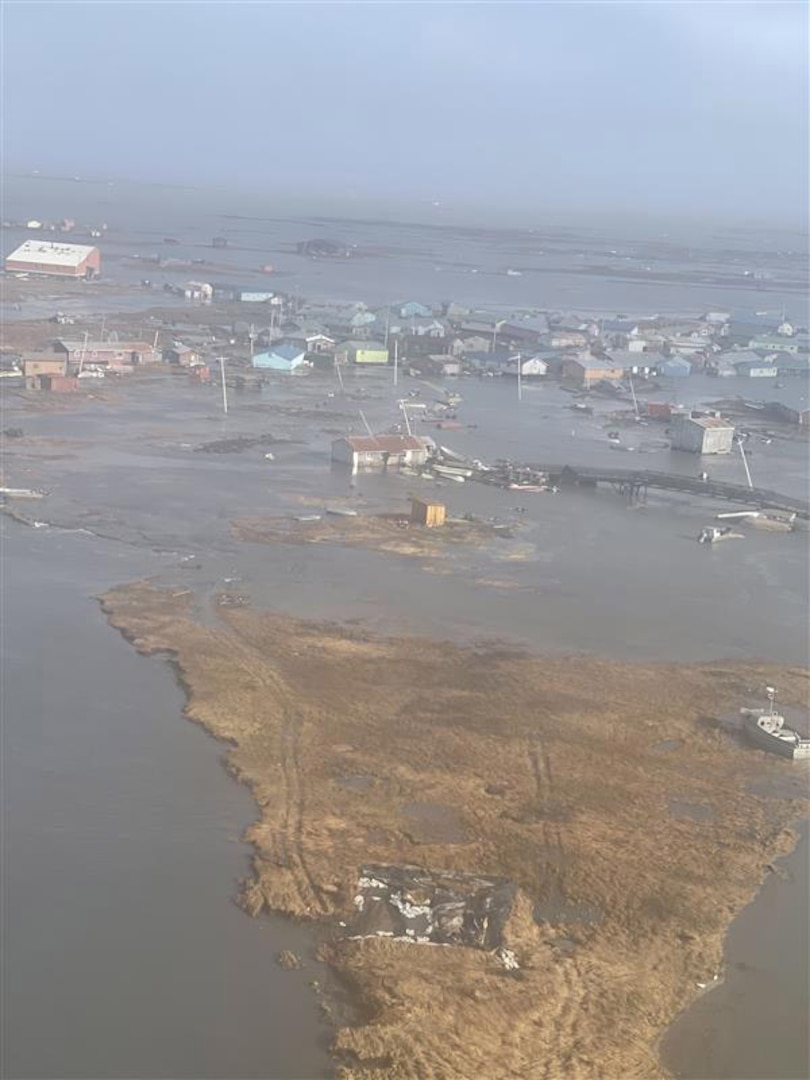 U.S. Coast Guard MH-60 Jayhawk helicopter aircrews conduct overflights of Kipnuk, Alaska, after coastal flooding impacted several western Alaska communities, Oct. 12, 2025.