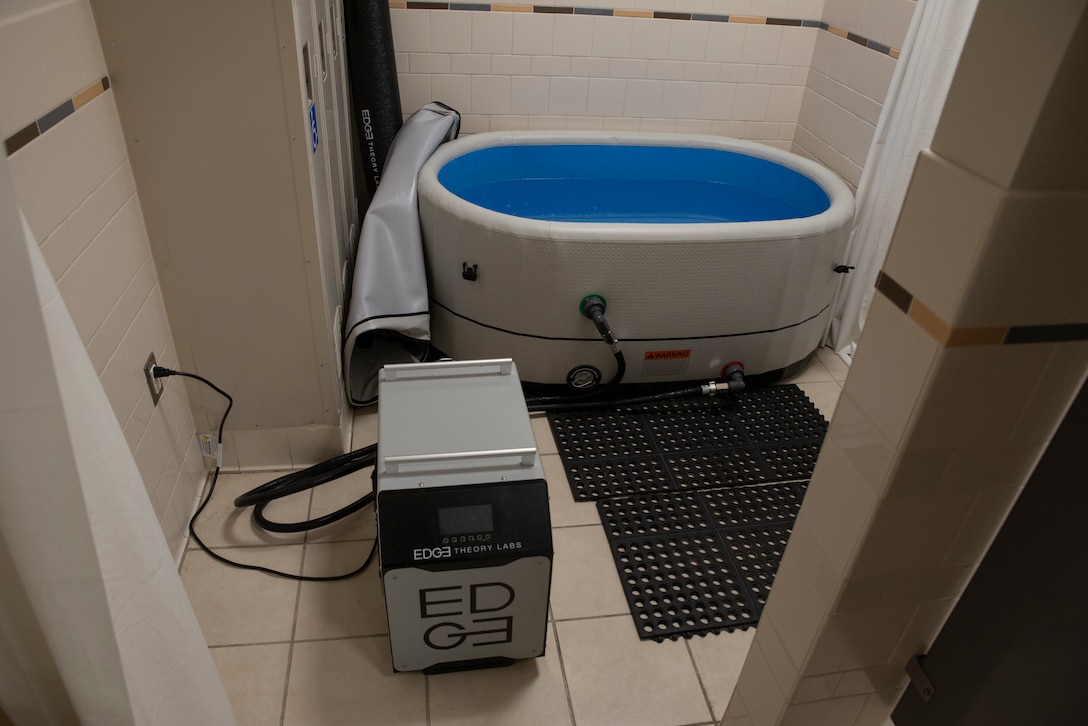 A cold plunge pool sits in a locker room