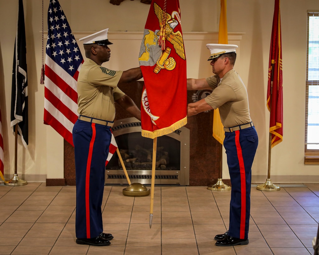 U.S. Marine Corps Maj. Christian J. Peterson, the Commanding Officer of Recruiting Station Albuquerque, 8th Marines Corps District, receives the Marine Corps colors from Sgt. Maj. Shonti J. Gregory, the Sergeant Major of Recruiting Station Albuquerque, during an assumption of command ceremony at New Mexico’s Veterans Memorial in Albuquerque, N.M.  on Aug. 28, 2025.