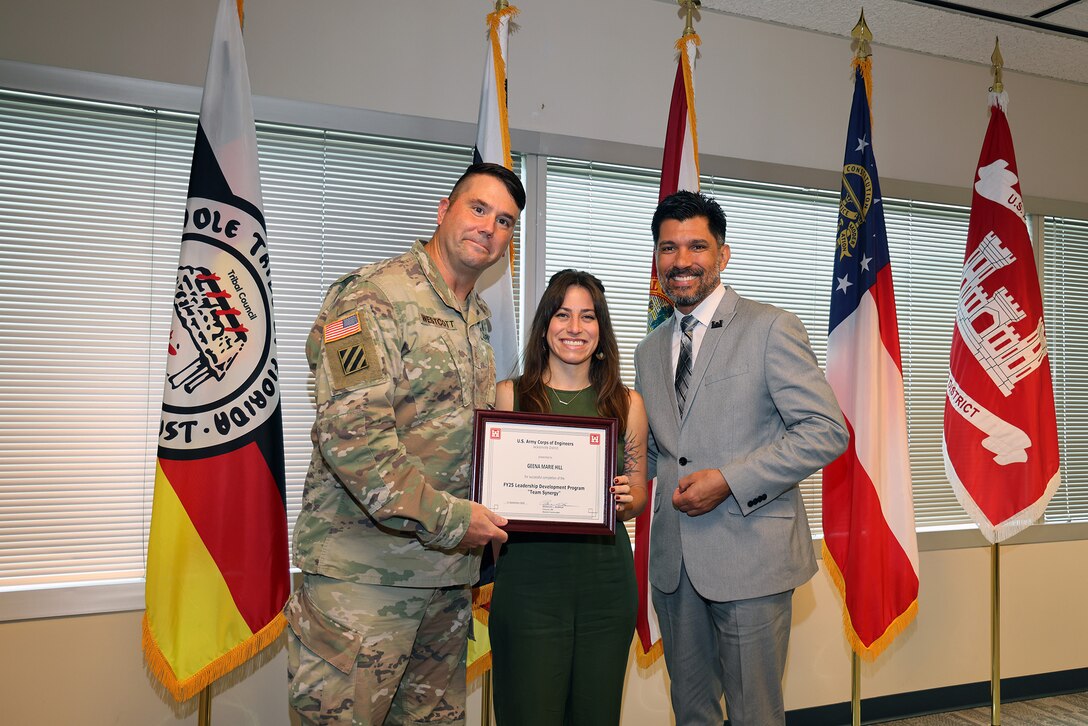 (Left to Right) Maj. Matt Westoctt, Jacksonville District Deputy Commander, Anthony Tallie and Howie Gonzalez, Jacksonville District Deputy District Engineer for Programs and Project Management present awards at the U.S. Army Corps of Engineers Jacksonville District completion and graduation of the 2025 Leadership Development Program Course during a ceremony at district headquarters at the Prudential Building on Jacksonville’s Southbank. (USACE photo by Bri Sanchez)