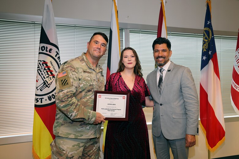 (Left to Right) Maj. Matt Westoctt, Jacksonville District Deputy Commander, Anthony Tallie and Howie Gonzalez, Jacksonville District Deputy District Engineer for Programs and Project Management present awards at the U.S. Army Corps of Engineers Jacksonville District completion and graduation of the 2025 Leadership Development Program Course during a ceremony at district headquarters at the Prudential Building on Jacksonville’s Southbank. (USACE photo by Bri Sanchez)