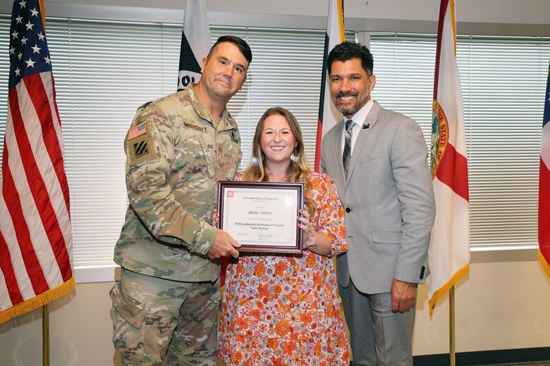 (Left to Right) Maj. Matt Westoctt, Jacksonville District Deputy Commander, Anthony Tallie and Howie Gonzalez, Jacksonville District Deputy District Engineer for Programs and Project Management present awards at the U.S. Army Corps of Engineers Jacksonville District completion and graduation of the 2025 Leadership Development Program Course during a ceremony at district headquarters at the Prudential Building on Jacksonville’s Southbank. (USACE photo by Bri Sanchez)