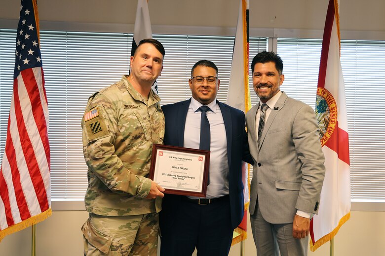 (Left to Right) Maj. Matt Westcott, Rafael Cardona and Howie Gonzalez, pose for a picture as the U.S. Army Corps of Engineers Jacksonville District celebrated the completion and graduation of the 2025 Leadership Development Program Course during a ceremony at district headquarters at the Prudential Building on Jacksonville’s Southbank. (USACE photo by Bri Sanchez)