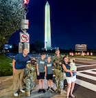 U.S. Air Force Airman Devontae Taylor, left, and Tech. Sgt. Richard Kramer, right, Airmen with the 172nd Airlift Wing, Mississippi National Guard, with the 112th Military Police Battalion, Mississippi National Guard, Task Force Magnolia, pose for a photo with the family they assisted in recovering their lost child near the Washington Monument, Washington, D.C., Oct. 6, 2025. About 2,300 National Guard members are supporting the D.C. Safe and Beautiful mission providing critical support to the D.C. Metropolitan Police Department in ensuring the safety of all who live, work and visit the District.