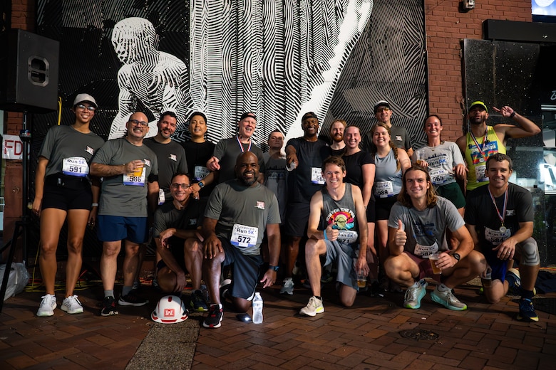 Runners pose for a photo post run