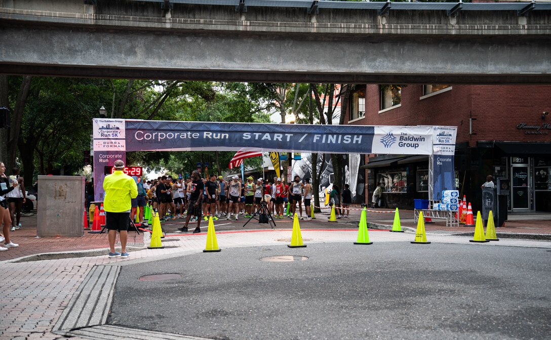 runners lined up behind the starting line in downtown Jacksonville.