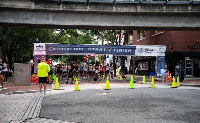 runners lined up behind the starting line in downtown Jacksonville.