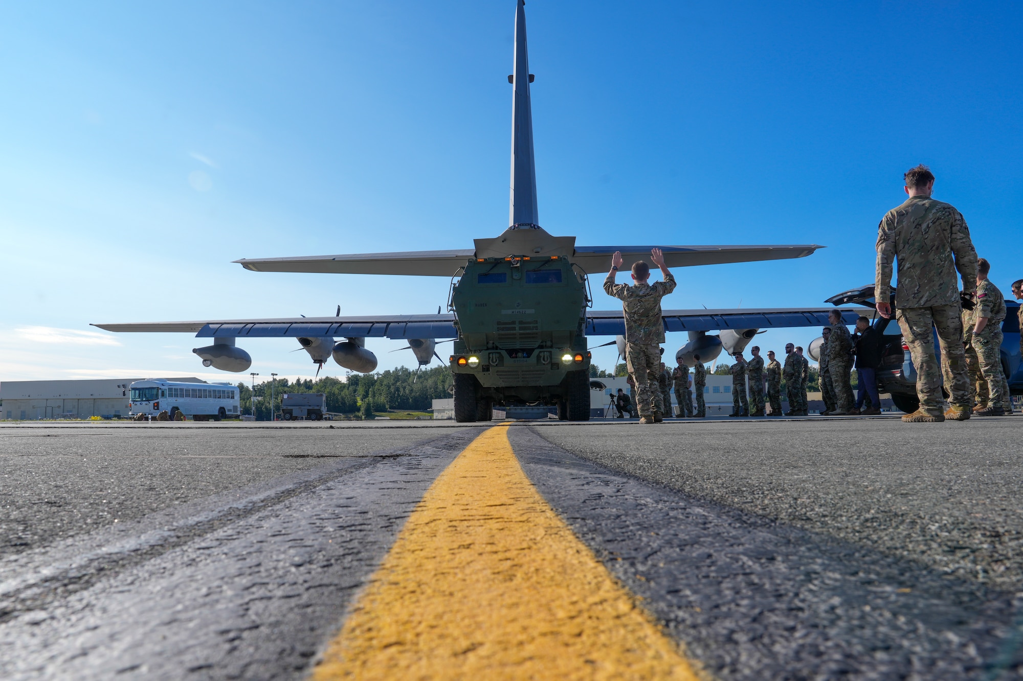 Air Commandos assigned to the 27th Special Operations Wing load a Marine Corps M142 High Mobility Artillery Rocket System (HIMARS) vehicle into an MC-130 Commando II during ARCTIC EDGE 2025 (AE25), at Joint Base Elmendorf-Richardson, Alaska, Aug 11, 2025. The use of HIMARS demonstrates the Marines’ ability to deliver precise, long-range fires in austere Arctic conditions. AE25 is a NORAD and U.S. Northern Command-led homeland defense exercise designed to improve readiness, demonstrate capabilities, and enhance Joint and Allied Force interoperability in the Arctic. (U.S. Air Force photo by Airman 1st Class Gracelyn Hess)