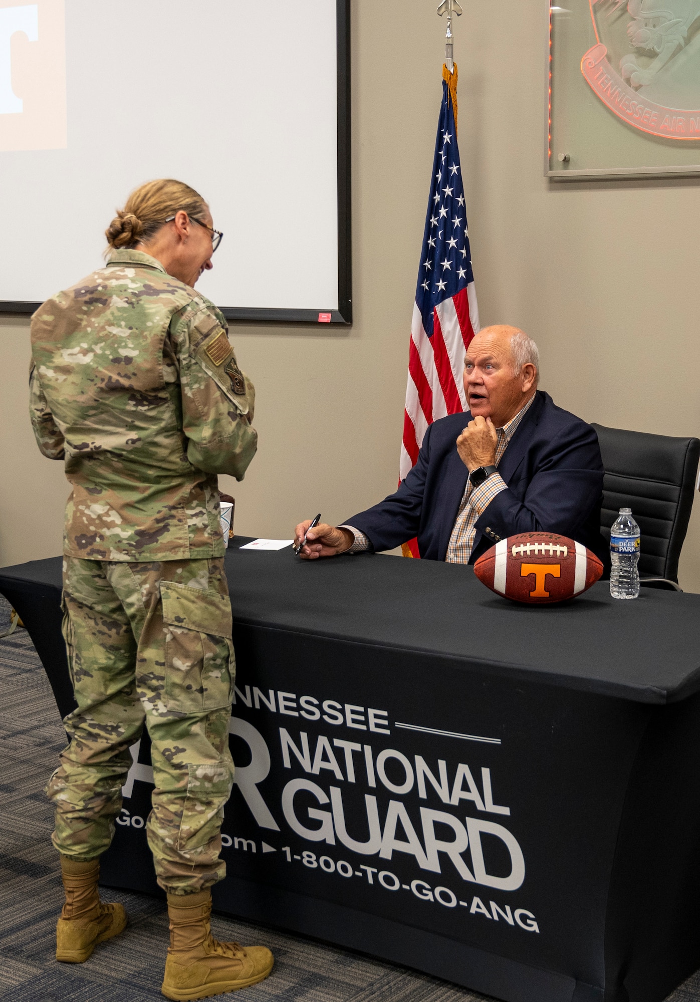 Former University of Tennessee Knoxville Athletic Director Phillip Fulmer speaks with an attendee of the Tennessee Senior Enlisted Conference.