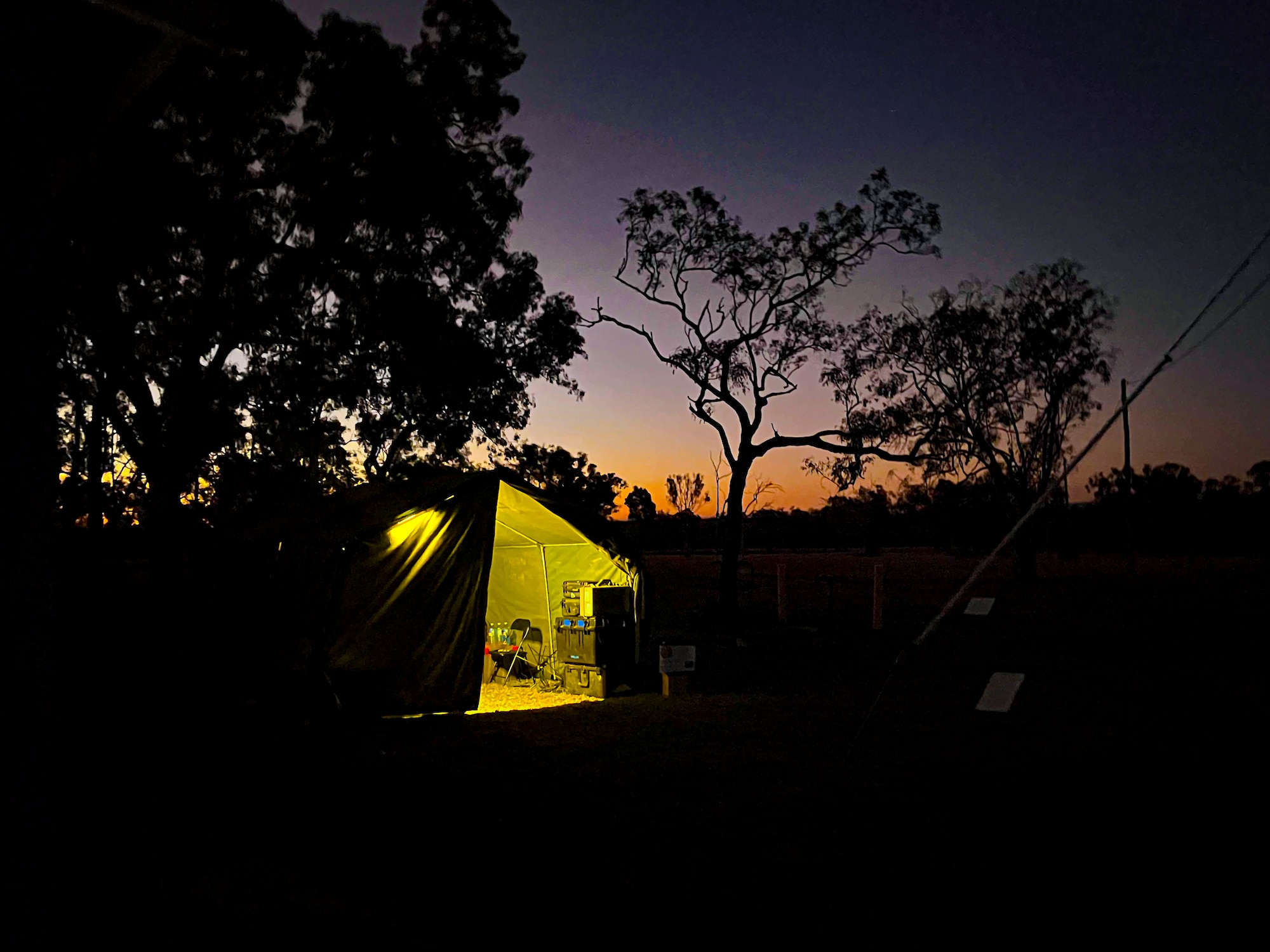 A U.S. Air Force Mission Sustainment Team assigned to the 27th Special Operations Wing finishes setting up camp during Talisman Sabre 2025 in Queensland, Australia, July 14, 2025. Held across multiple regions in Australia and Papua New Guinea, TS25 is designed to enhance multinational coordination in responding to regional crises and foster peace, stability, and prosperity in the Indo-Pacific. (U.S. Air Force photo by Airman 1st Class Gracelyn Hess)