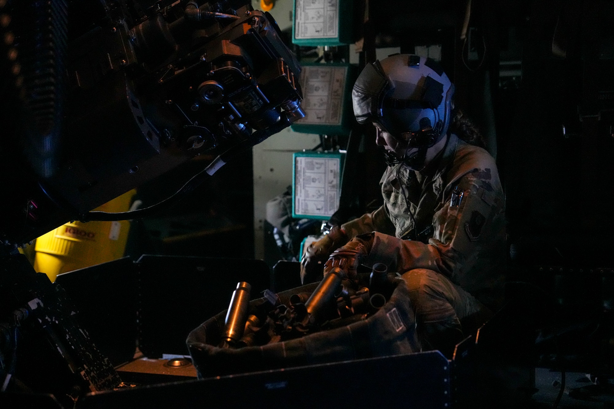 A U.S. Air Force Air Commando assigned to the 27th Special Operations Wing catches spent brass casings during live-fire training as part of exercise Talisman Sabre 2025 over a live-fire range in Australia, July 11, 2025. Held across multiple regions in Australia and Papua New Guinea, TS25 is designed to enhance multinational coordination in responding to regional crises and foster peace, stability, and prosperity in the Indo-Pacific. (U.S. Air Force photo by Airman 1st Class Gracelyn Hess)