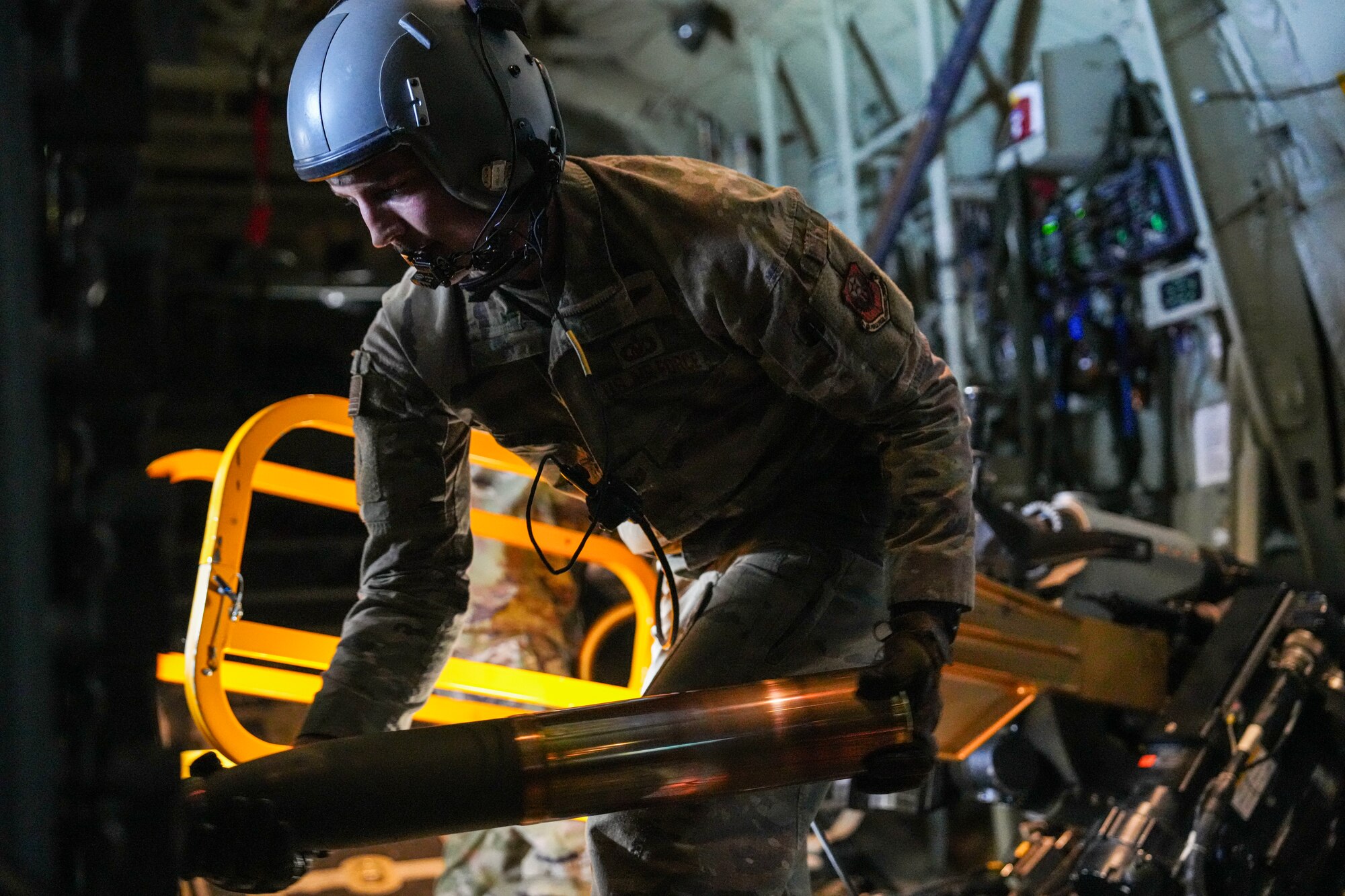 A U.S. Air Force Air Commando assigned to the 27th Special Operations Wing arms an M137A1 105mm artillery cannon during live-fire training over a live-fire range in Australia during exercise Talisman Sabre 2025, July 11, 2025. Held across multiple regions in Australia and Papua New Guinea, TS25 is designed to enhance multinational coordination in responding to regional crises and foster peace, stability, and prosperity in the Indo-Pacific. (U.S. Air Force photo by Airman 1st Class Gracelyn Hess)