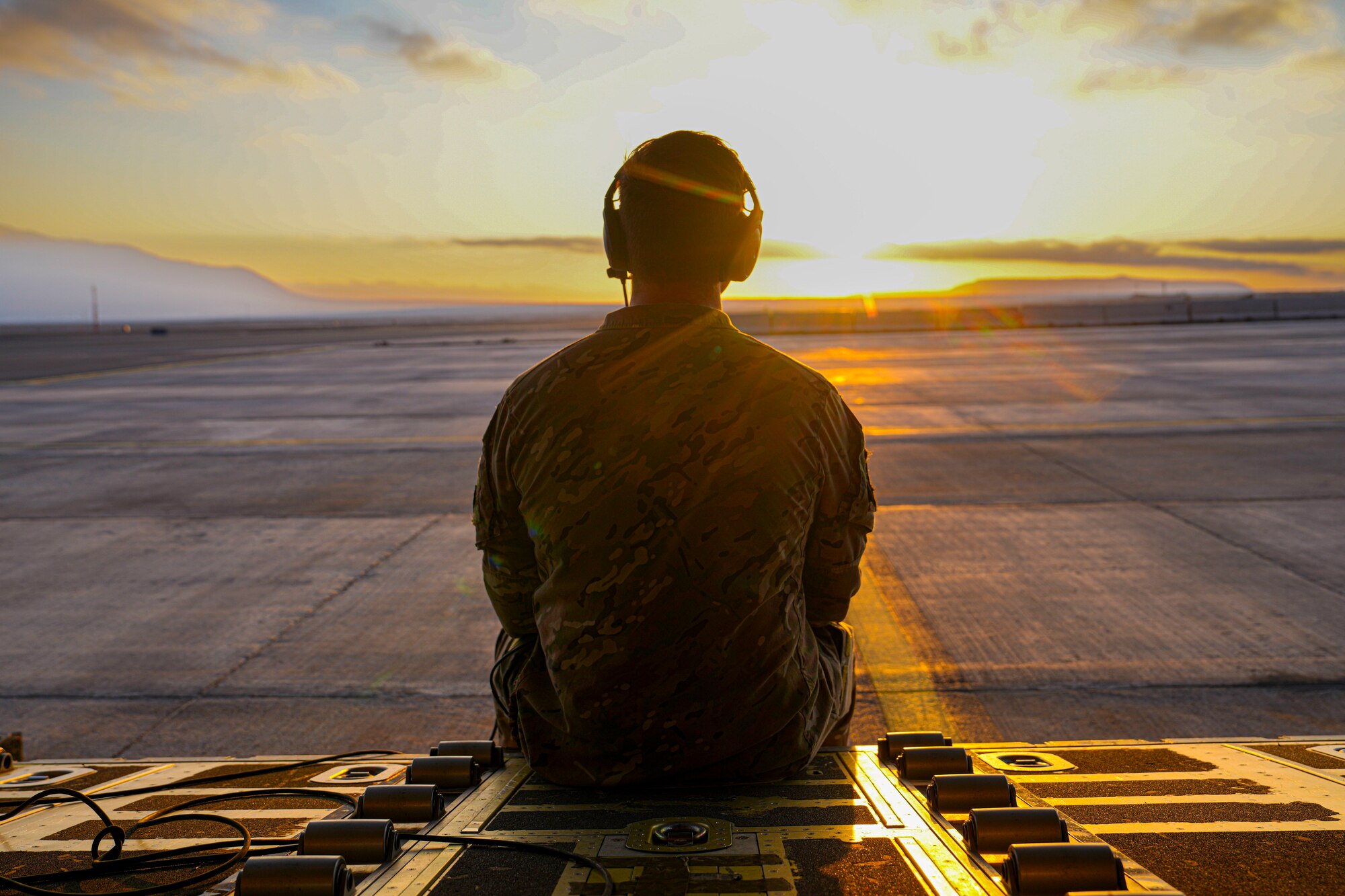 An Air Commando sits on the ramp of an MC-130 Air Commando II after conducting interoperability training with partner forces, including conducting a static line jump of 89 Chilean jumpers during an airborne exercise as part of SOUTHERN STAR 2025 in Antofagasta, Chile, May 30, 2025. SOUTHERN STAR ‘25 is a multinational special operations exercise is taking place across Chile from May 26 to June 8, uniting forces from six nations and 10 observing countries to enhance interoperability and strengthen global SOF partnerships through joint training from as far north as Antofagasta to the southern region of Punta Arenas. (Photo by Airman 1st Class Gracelyn Hess)