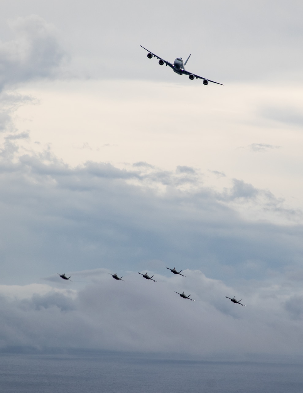 PHILIPPINE SEA (Oct. 20, 2025) - Japan Maritime Self Defense Force Kawasaki P-1, U.S. Marine Corps F-35B Lightning II assigned to Marine Fighter Attack Squadron (VMFA) 242, and U.S. Navy F-35C Lightning II assigned to Strike Fighter Squadron (VFA) 147 fly together in the Philippine Sea, Oct. 20, 2025 in support of Annual Exercise (ANNUALEX) 25. ANNUALEX is a multilateral exercise that enhances the Japan and U.S. alliance, strengthens naval interoperability and demonstrates a joint commitment to a free and open Indo-Pacific. (U.S. Navy photo by Petty Officer 1st Class R. Ezekiel Duran)