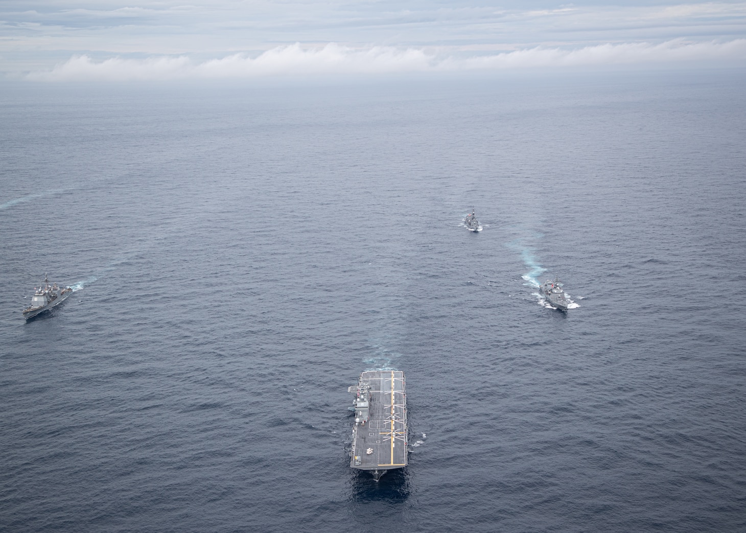 PHILIPPINE SEA (Oct. 20, 2025) - Japan Maritime Self-Defense Force Izumo-class multi-functional destroyer JS Kaga (DDH 184) (center), accompanied by JMSDF escorts, and U.S. Navy Ticonderoga-class guided missile cruiser USS Robert Smalls (CG 62) (right) forces sail together in the Philippine Sea, Oct. 20, 2025 in support of Annual Exercise (ANNUALEX) 25. ANNUALEX is a multilateral exercise that enhances the Japan and U.S. alliance, strengthens naval interoperability and demonstrates a joint commitment to a free and open Indo-Pacific. (U.S. Navy photo by Petty Officer 1st Class R. Ezekiel Duran)