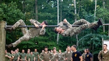 British Royal Marines conduct the obstacle course as part of “Virginia Tempest” at The Basic School on Marine Corps Base Quantico, Virginia, July 28, 2025. Virginia Tempest is an annual training event where Royal Marines and U.S. Marines collaborate in training such as the obstacle course, Marine Corps Martial Arts Program, and other rigorous events, ultimately designed to support interoperability and maintaining the historic working relationship between the organizations. (U.S. Marine Corps photo by Lance Cpl. Braydon Rogers)
