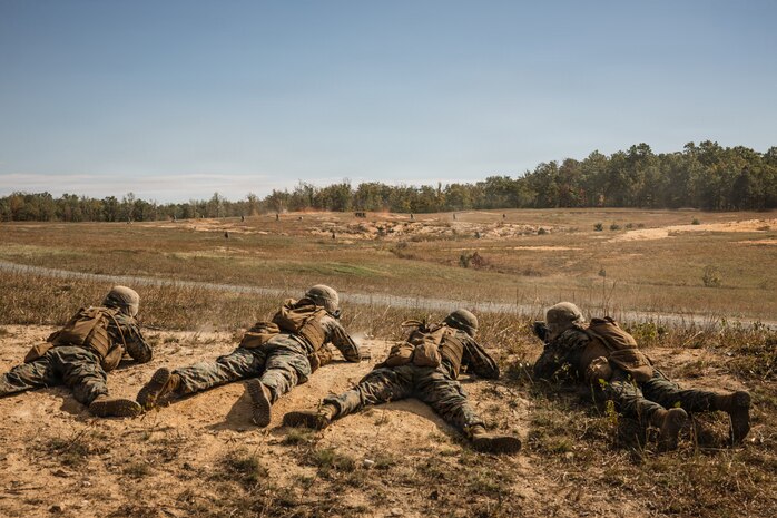 U.S. Marine Corps students with Company D, Basic Officer Course 4-25, The Basic School, provide support-by-fire during a live-fire Field Firing Exercise on Marine Corps Base Quantico, Virginia, Oct. 10, 2025. The FFEX provided students the opportunity to refine their skills in conducting a live-fire assault on a target with support-by-fire and maneuver elements. (U.S. Marine Corps photo by Cpl. Joshua Barker)