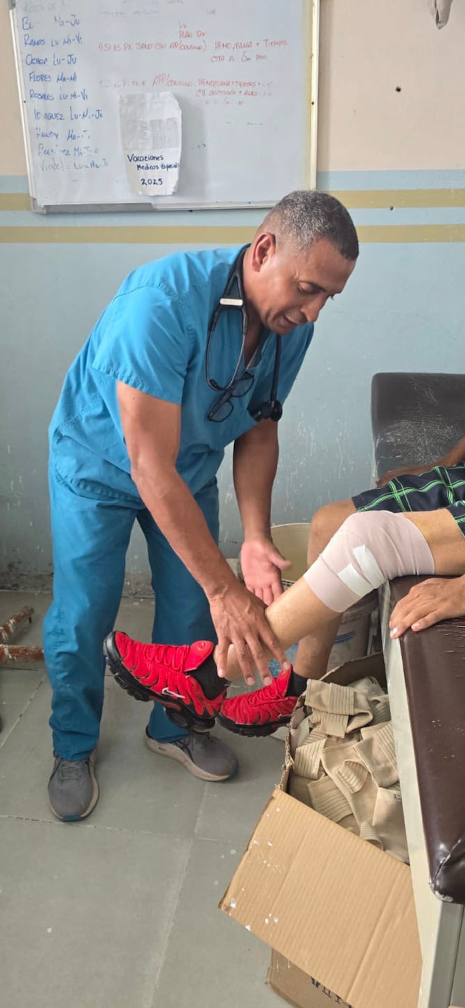 A medical person renders aid to a patient.
