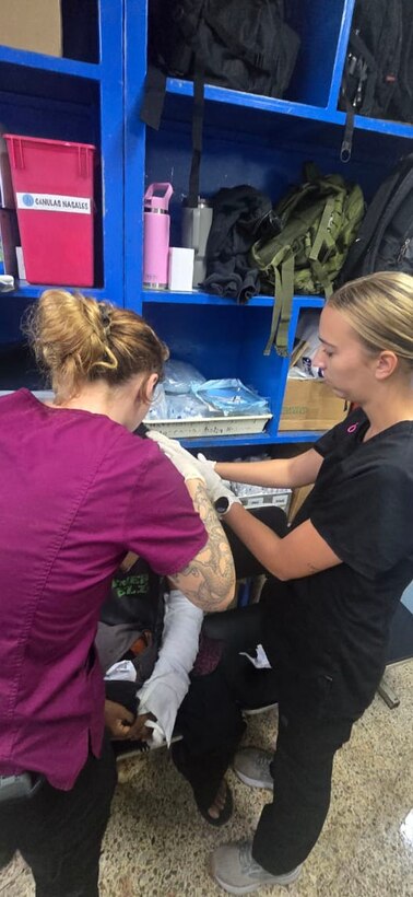 medical personnel treat a patient.