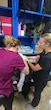 medical personnel treat a patient.