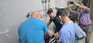 medical staff give medical attention to a patient.