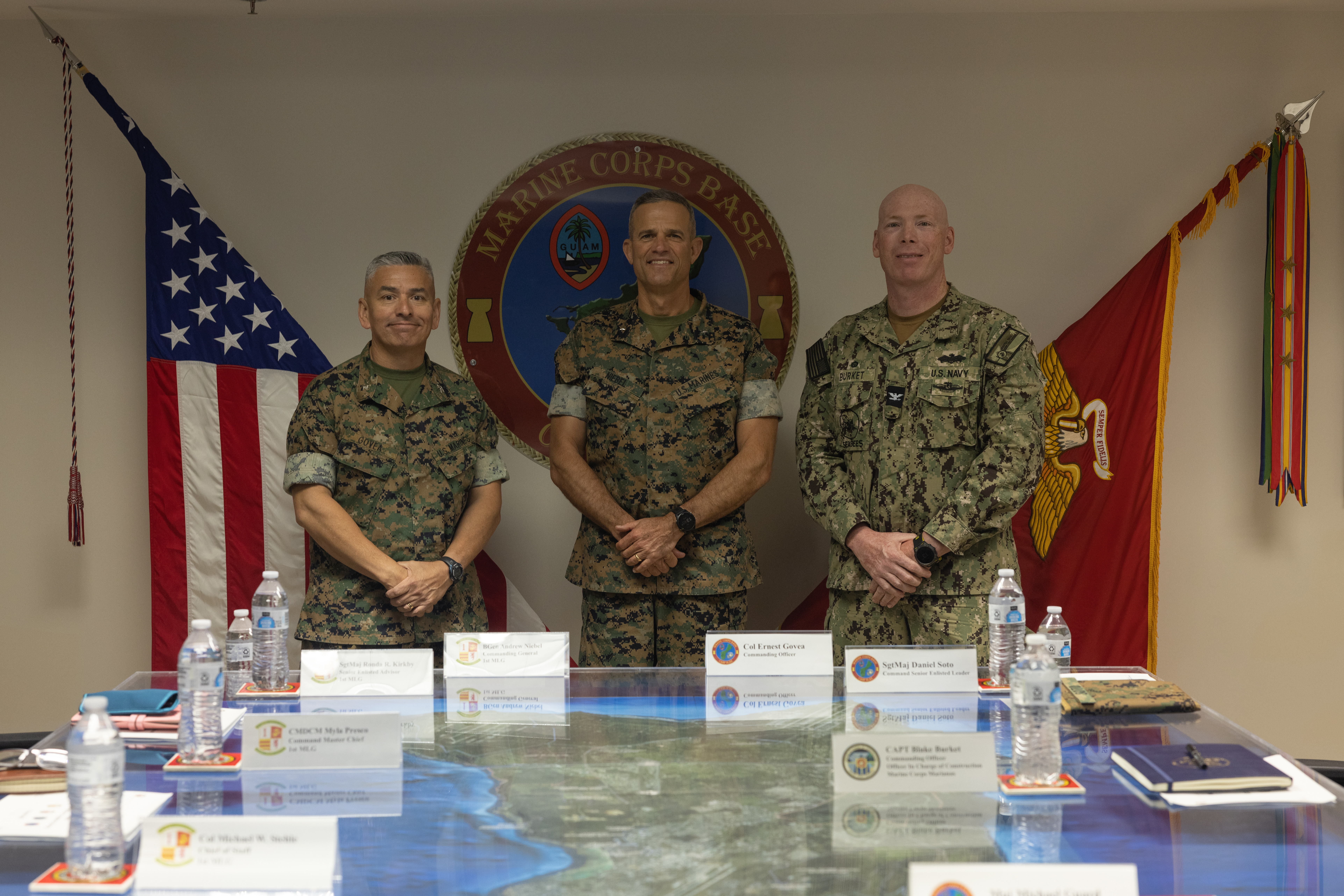U.S. Marine Corps Col. Ernest Govea, commanding officer, Marine Corps Base Camp Blaz, Brig. Gen. Andrew M. Niebel, commanding general, 1st Marine Logistics Group, and U.S. Navy Capt. Blake Burket, commanding officer, Officer in Charge of Construction, pose for a group photo on MCB Camp Blaz, Guam, April 18, 2025. Niebel and his staff visited Camp Blaz to see the progression of the base’s development and capabilities. (U.S. Marine Corps photo by Cpl. Brayden Daniel)
