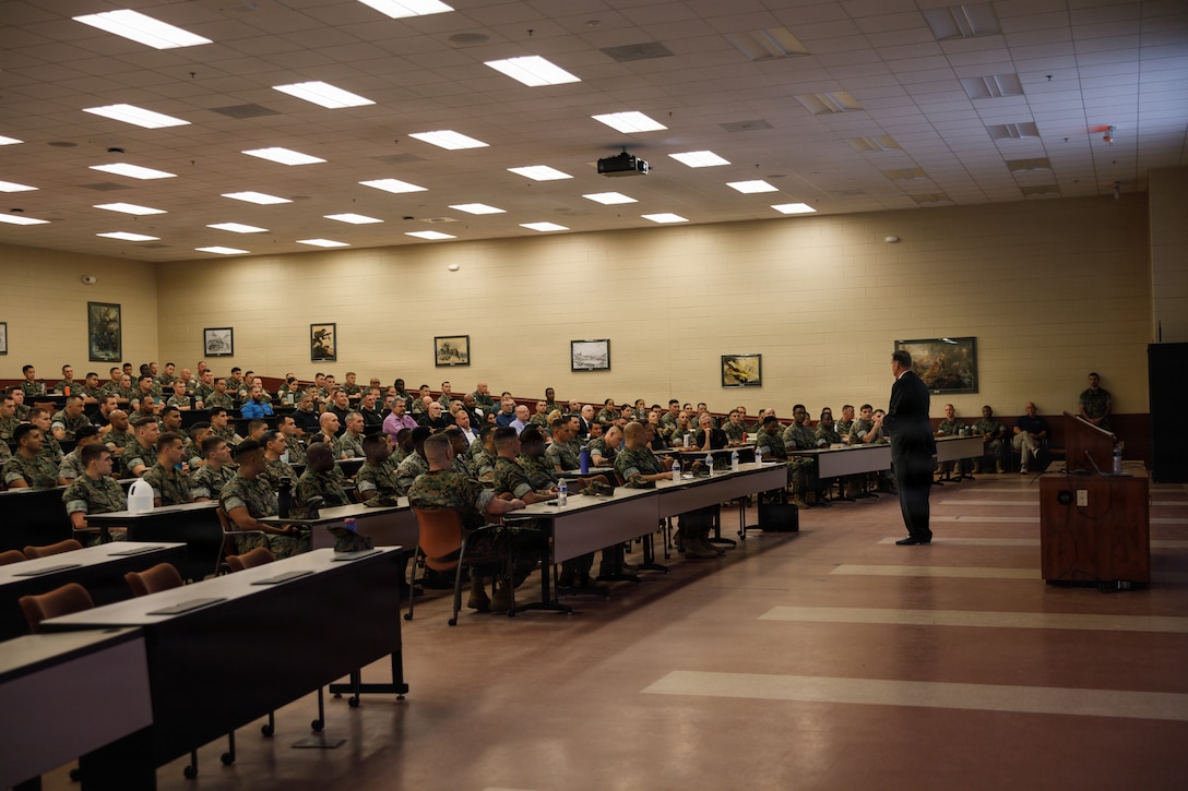 U.S. Marine Corps Ret. Gen. James L. Jones, 32nd Commandant of the Marine Corps, speaks to Marines attending the Marine Corps Martial Arts 25th anniversary symposium hosted by the Martial Arts and Fitness Center of Excellence on Marine Corps Base Quantico, Virginia, Oct. 8, 2025. The goal of this symposium was to provide the Fleet Marine Force with instructions and practical application on the new tan-black belt syllabus and the new free sparring events while integrating guided discussions fostering character development and recounting the storied tradition of the Marine Corps Martial Arts Program. (U.S. Marine Corps photo by Cpl. Joshua Barker)