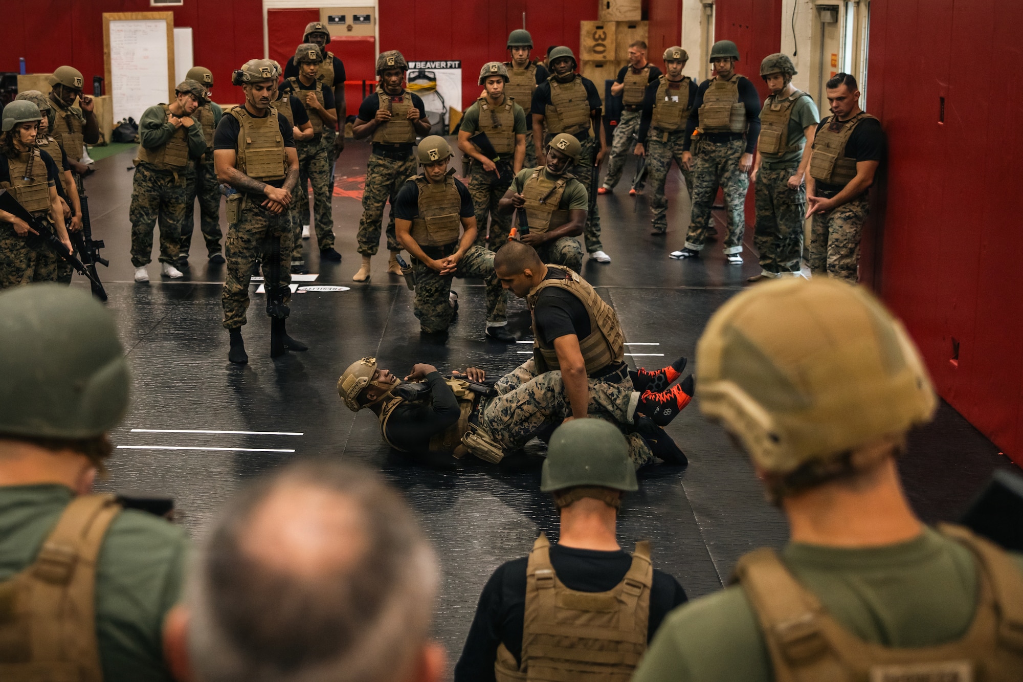 U.S. Marine Corps Staff Sgt. Daniel N. Morales, a Martial Arts Instructor Trainer and motor vehicle operator, right, and Sgt. Arkel Brown, a MAIT and mortarman, both with The Martial Arts and Fitness Center of Excellence, The Basic School, Training Command, demonstrate techniques during the Marine Corps Martial Arts 25th anniversary symposium hosted by the MAFCE on Marine Corps Base Quantico, Virginia, Oct. 8, 2025. The goal of this symposium was to provide the Fleet Marine Force with instructions and practical application on the new tan-black belt syllabus and the new free sparring events while integrating guided discussions fostering character development and recounting the storied tradition of the Marine Corps Martial Arts Program. (U.S. Marine Corps photo by Cpl. Joshua Barker)