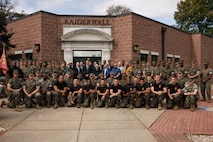 U.S. Marine Corps Ret. Gen. James L. Jones, 32nd Commandant of the Marine Corps, center, Martial Arts Instructor and Instructor Trainers, and former Martial Arts Fitness and Center of Excellence staff pose for a group photo during the Marine Corps Martial Arts 25th anniversary symposium hosted by the MAFCE at Raider Hall on Marine Corps Base Quantico, Virginia, Oct. 8, 2025. The goal of this symposium was to provide the Fleet Marine Force with instructions and practical application on the new tan-black belt syllabus and the new free sparring events while integrating guided discussions fostering character development and recounting the storied tradition of the Marine Corps Martial Arts Program. (U.S. Marine Corps photo by Cpl. Joshua Barker)