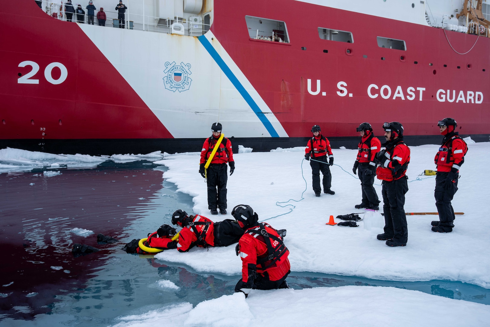 U.S. Coast Guard Cutter Healy (WAGB 20) ice rescue team members conduct training while operating in the Arctic Ocean, July 29, 2025. Training in Arctic conditions ensures readiness and proficiency in the event a crew member falls overboard or falls in the water during on-ice operations. (U.S. Coast Guard photo by Petty Officer 3rd Class Chris Sappey)