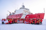 Crewmembers, researchers, and partner nation representatives sailing aboard U.S. Coast Guard Cutter Healy (WAGB 20) pose for a photo on the ice in the Arctic Ocean, Oct. 1, 2025. Coast Guard operations in the Arctic are critical to expanding our understanding of the Arctic operating environment for advancing national security objectives. (U.S. Coast Guard photo by Petty Officer 3rd Class Chris Sappey)