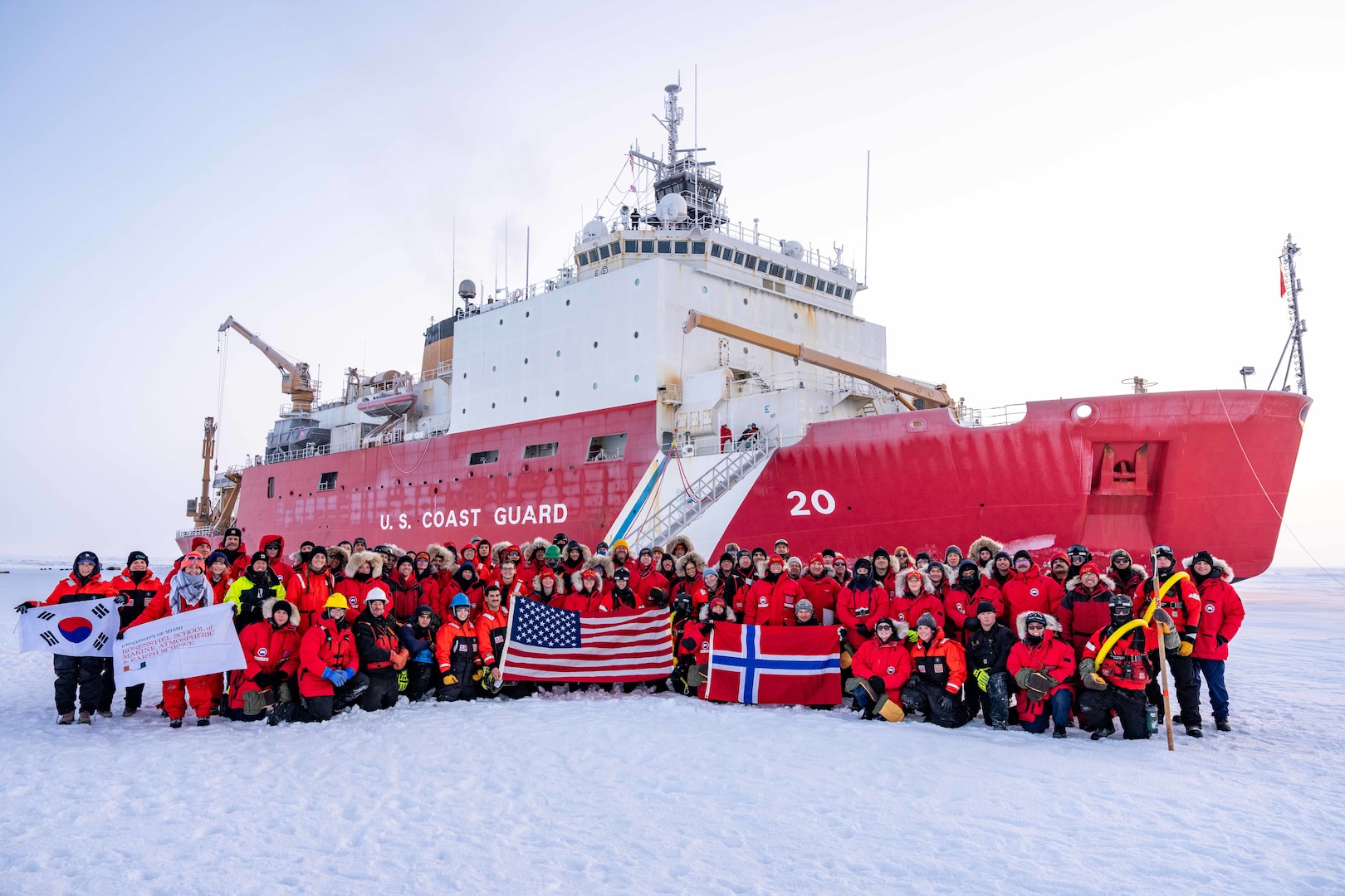 Crewmembers, researchers, and partner nation representatives sailing aboard U.S. Coast Guard Cutter Healy (WAGB 20) pose for a photo on the ice in the Arctic Ocean, Oct. 1, 2025. Coast Guard operations in the Arctic are critical to expanding our understanding of the Arctic operating environment for advancing national security objectives. (U.S. Coast Guard photo by Petty Officer 3rd Class Chris Sappey)