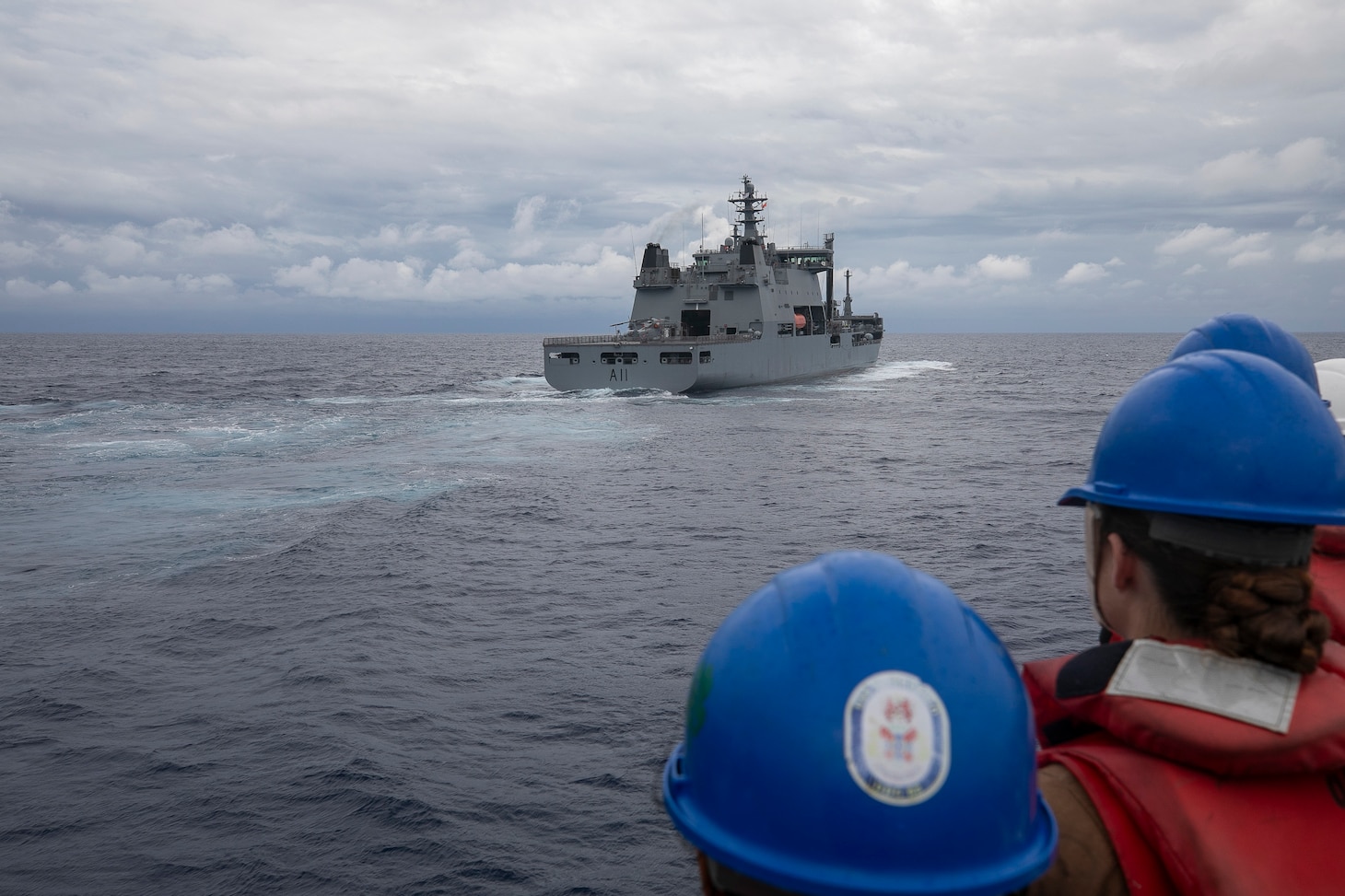 Sailors assigned to Arleigh Burke-class guided-missile destroyer USS Fitzgerald (DDG 62) man the rails while approaching the Royal New Zealand Navy Polar-class sustainment vessel HMNZS Aotearoa (A11) in preparation for replenishment-at-sea during the maritime cooperative activity (MCA) in the Philippines’ exclusive economic zone (EEZ), Oct. 30, 2025.