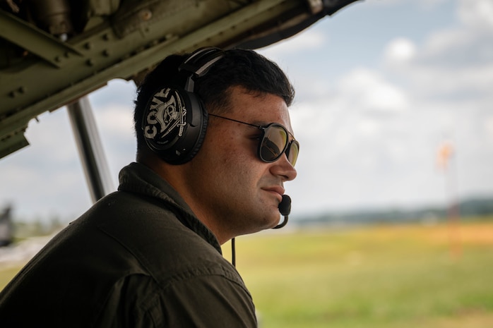 U.S. Marine Corps Sgt. Rafael Morales Maldonado, a fixed-wing aircraft loadmaster with 2nd Marine Aircraft Wing assigned to Special Purpose Marine Air-Ground Task Force 250, sits in the back of a C-130 Hercules aircraft at Cobb County International Airport, Kennesaw, Georgia, during Marine Week Atlanta, Aug. 31, 2025. Marines stationed across the globe commemorate the 250th anniversary of the Marine Corps, honoring a distinguished legacy of service, sacrifice, and unwavering fidelity to both the nation and the Corps. (U.S. Marine Corps photo by Sgt. Alexis French)