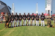 U.S. Marines with the United States Marine Corps Silent Drill Platoon pose for a photo with the military working dog handlers of Marine Corps Police Department Albany following their performance the College Football Aflac Kickoff show during Marine Week Atlanta in Atlanta, Ga., Aug. 31, 2025.The year 2025 marks the 250th anniversary of the United States Marine Corps, a milestone that highlights the legacy, transformation and enduring spirit of the Corps since 1775. Throughout the year, Marines across the globe will commemorate this anniversary by honoring the service and sacrifice of those who served before them and by remaining faithful to the motto Semper Fidelis. (U.S. Marine Corps photo by Cpl. Christopher Prelle)