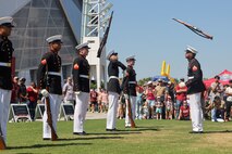 U.S. Marines with the United States Marine Corps Silent Drill Platoon execute their "double inspection" sequence during a performance at the College Football Aflac Kickoff show during Marine Week Atlanta in Atlanta, Ga., Aug. 31, 2025. The year 2025 marks the 250th anniversary of the United States Marine Corps, a milestone that highlights the legacy, transformation and enduring spirit of the Corps since 1775. Throughout the year, Marines across the globe will commemorate this anniversary by honoring the service and sacrifice of those who served before them and by remaining faithful to the motto Semper Fidelis. (U.S. Marine Corps photo by Cpl. Christopher Prelle)
